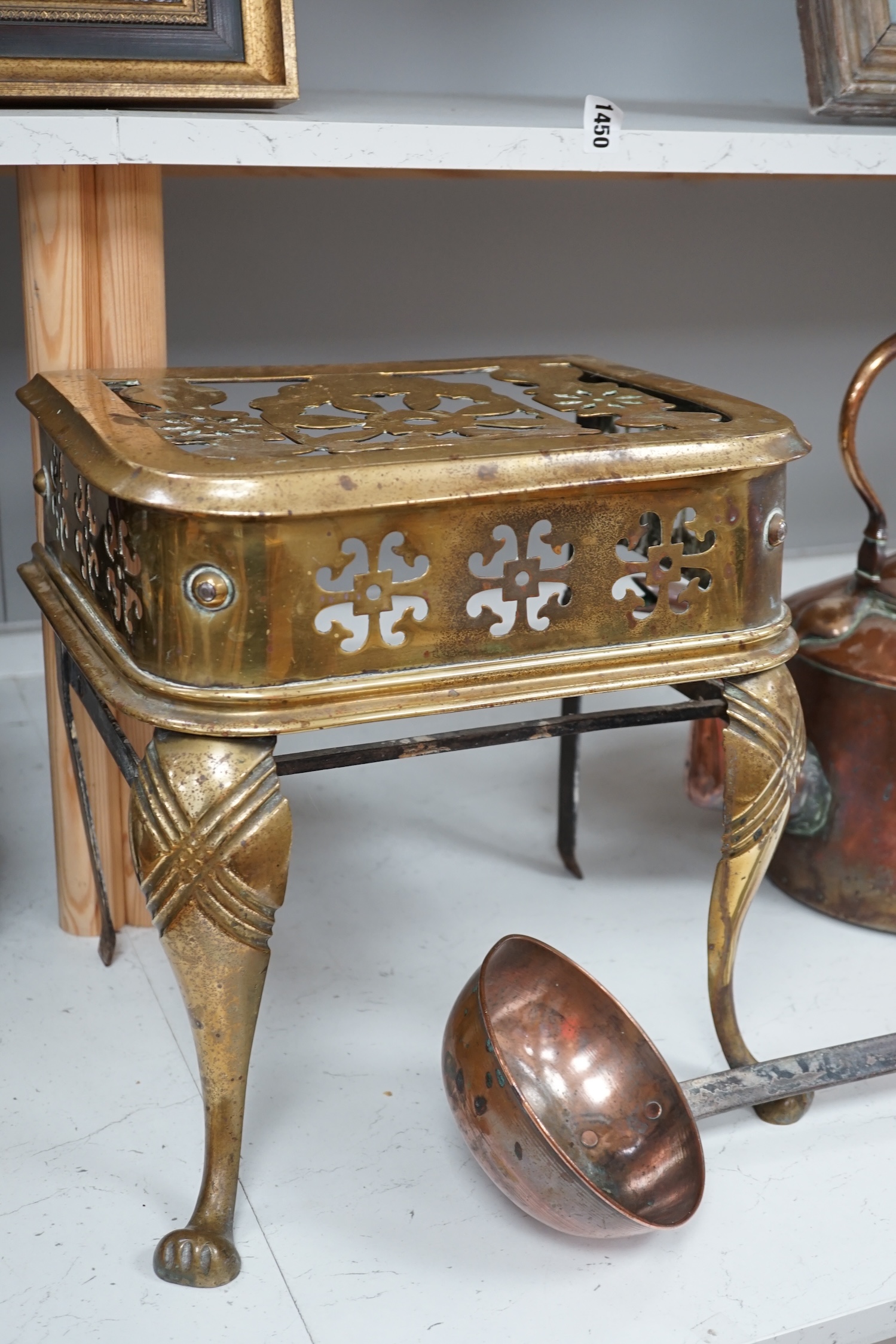 A late Victorian copper kettle, a brass stand and a ladle, largest 39cm wide. Condition - fair